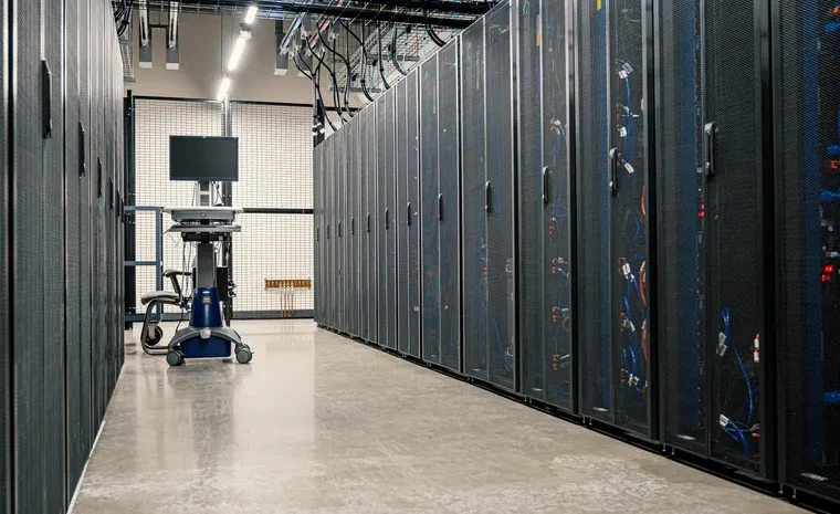 Modern data center corridor with server racks representing cloud technology