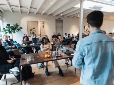 Small business owner presenting a slide deck to colleagues