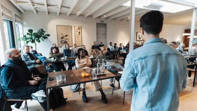 Small business owner presenting a slide deck to colleagues