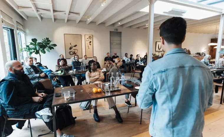 Small business owner presenting a slide deck to colleagues
