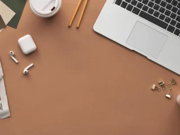 Laptop and desk workspace for building a resume with an AI tool