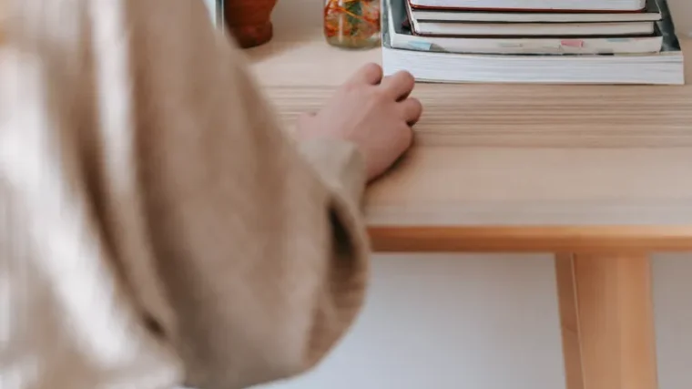 Freelancer working on a laptop at a home office desk
