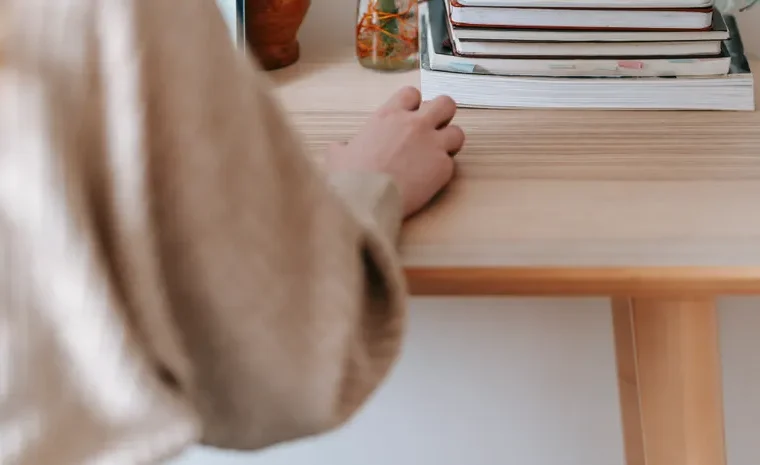 Freelancer working on a laptop at a home office desk