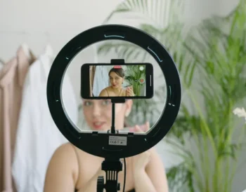 Person recording short-form video content on a smartphone for social media