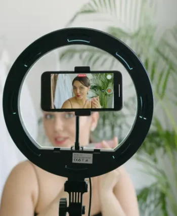 Person recording short-form video content on a smartphone for social media