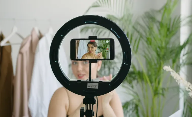 Person recording short-form video content on a smartphone for social media
