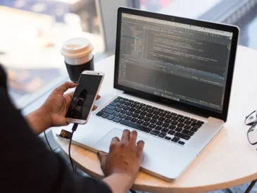 Cloud storage icons synced across laptop and mobile devices