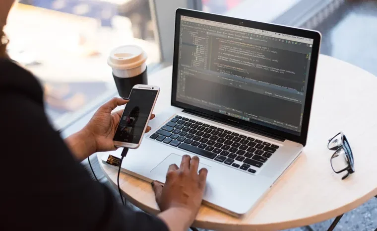 Cloud storage icons synced across laptop and mobile devices