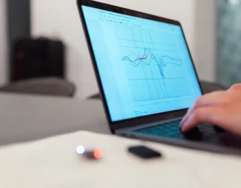 Laptop displaying a performance graph representing PC speed monitoring