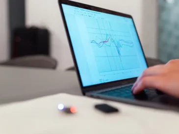 Laptop displaying a performance graph representing PC speed monitoring