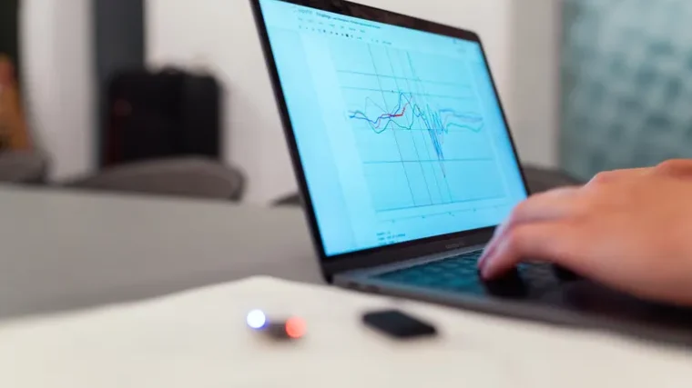 Laptop displaying a performance graph representing PC speed monitoring