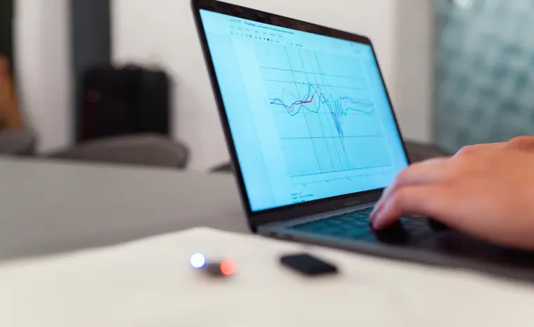 Laptop displaying a performance graph representing PC speed monitoring