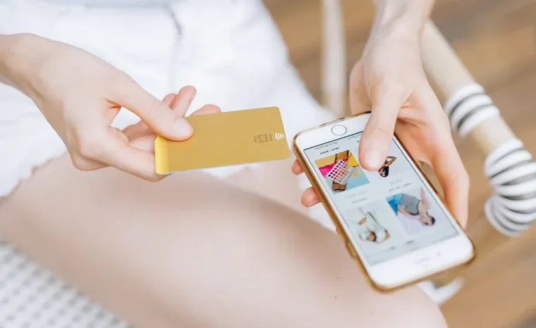 Person shopping online on a smartphone checking product reviews